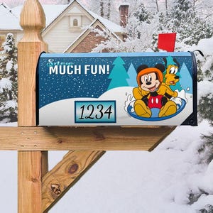 May include: A blue and white mailbox with a winter scene featuring Mickey Mouse and Pluto sledding. The mailbox has the text "Snow Much Fun!" and the number "1234" on it.