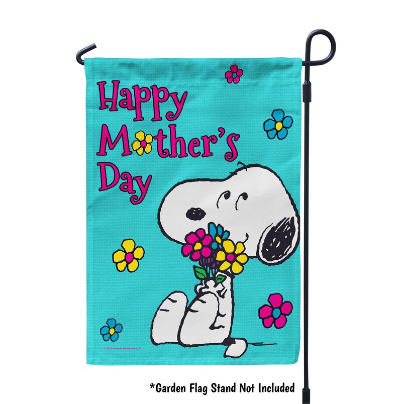 May include: A turquoise blue garden flag with the text "Happy Mother's Day" in pink and black lettering. A cartoon image of Snoopy holding a bouquet of flowers is in the bottom right corner of the flag.