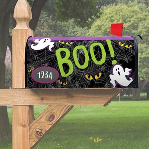 May include: A black Halloween mailbox with a spiderweb design, the word "BOO!" in green, and white ghost graphics. The mailbox also features yellow eyes and the number 1234.