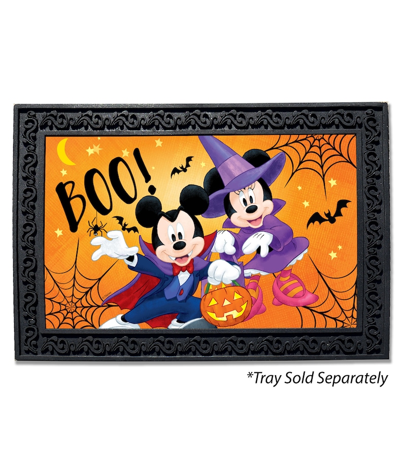 May include: A Halloween-themed doormat featuring Mickey Mouse and Minnie Mouse dressed in costumes. Mickey is a vampire and Minnie is a witch. The doormat has a black frame with a decorative design and the word "BOO!" in large letters.