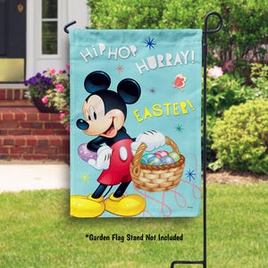 May include: A blue garden flag with Mickey Mouse holding a basket of Easter eggs. The flag reads "Hip Hop Hurray! Easter!"