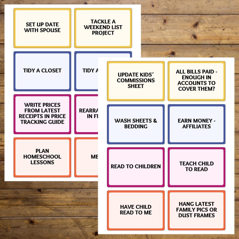 May include: Two sheets of paper with colorful boxes containing text. The text includes phrases like "Set up date with spouse," "Tidy a closet," and "Read to children." The boxes have various colored borders, including yellow, blue, and pink, against a wood grain background.