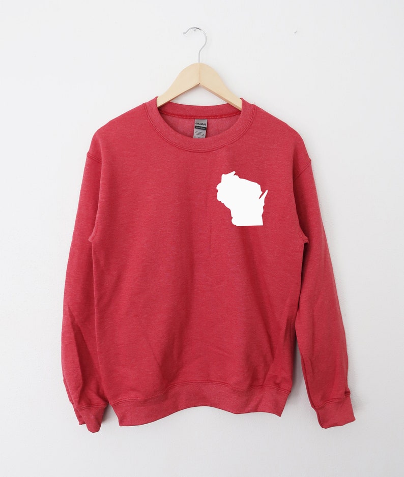 May include: Red sweatshirt with a white outline of the state of Wisconsin on the left chest.