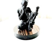 Native American Indian or Hindu Man Smoking Pipe Iron Black
