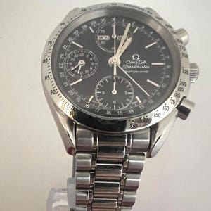 Reloj Omega Speedmaster vintage con fecha y día, esfera azul, Ref.: 175.0044