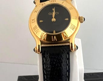 Reloj vintage Gucci 6500L de cuarzo chapado en oro para mujer, esfera azul.