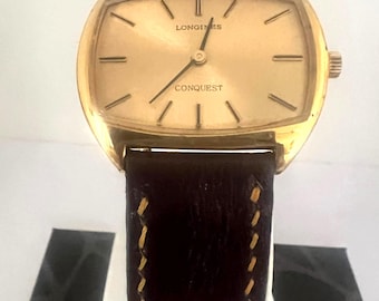 Reloj vintage Longines Conquest Manuel chapado en oro.
