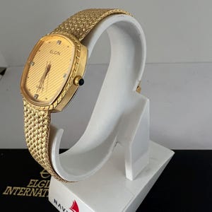 Reloj Elgin para dama con esfera dorada FK266, reloj suizo mtv de cuarzo. imagen 2