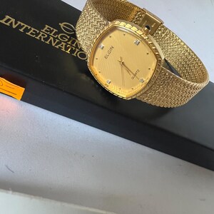 Reloj Elgin para dama con esfera dorada FK266, reloj suizo mtv de cuarzo. imagen 3