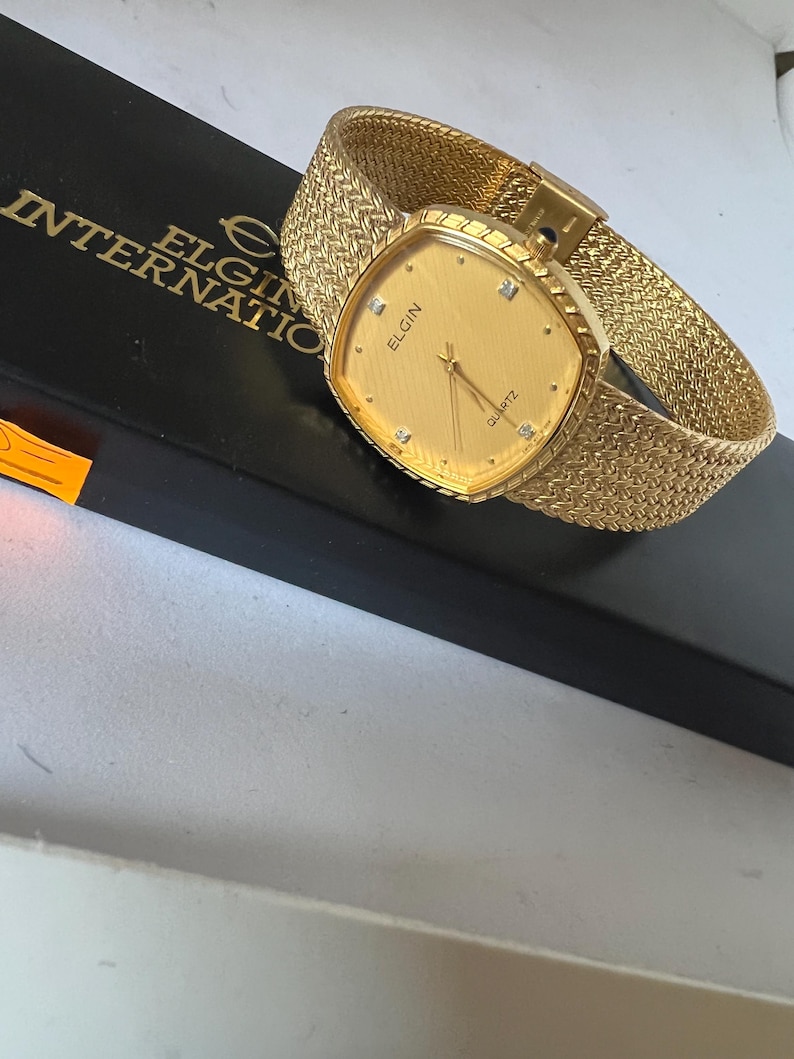 Reloj Elgin para dama con esfera dorada FK266, reloj suizo mtv de cuarzo. imagen 3