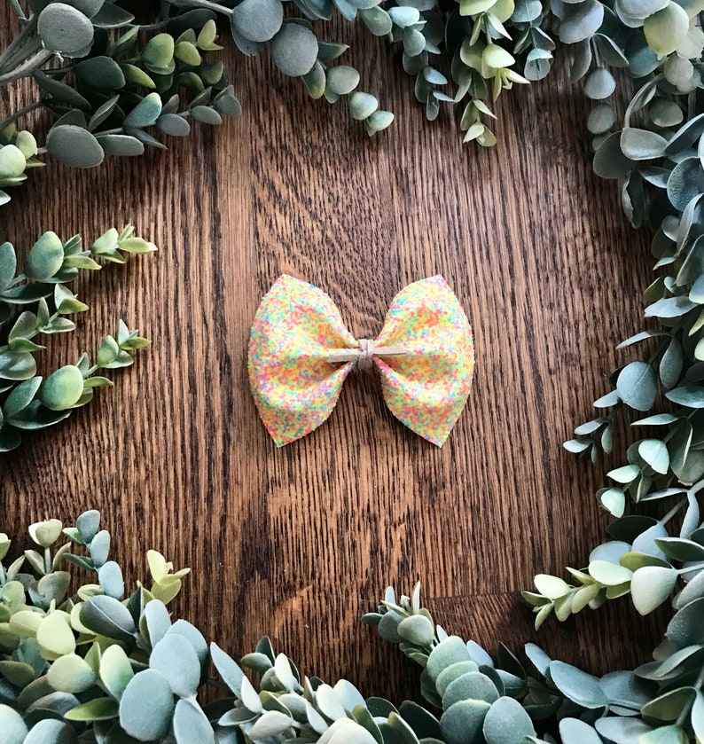 glitter canvas bow finished on a nylon headband or alligator clip Available in 5 beautiful glitters. Large