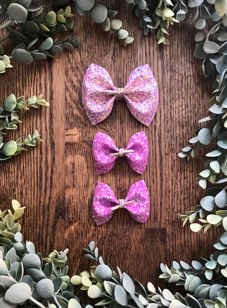 glitter canvas bow finished on a nylon headband or alligator clip Available in 5 beautiful glitters. Large