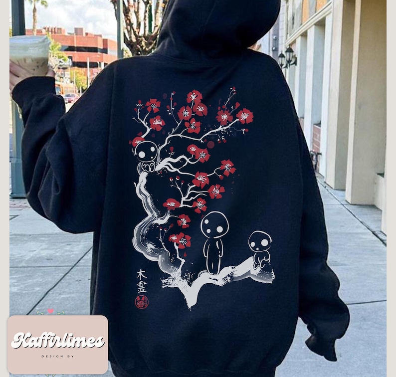 May include: Black hoodie featuring a white and red floral design with three small figures. The design includes Japanese text and a red seal. The hoodie has a drawstring hood and long sleeves. The brand name "Kaffirlimes" is printed at the bottom.