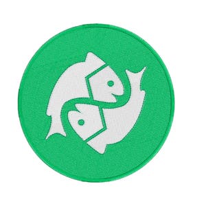 May include: A green circle with a white outline featuring a stylized image of two fish swimming in opposite directions. The fish are facing each other and their tails are intertwined.
