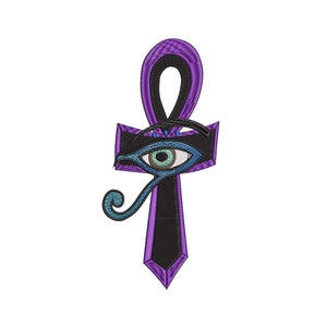 May include: Purple and black Ankh with a blue and green Eye of Horus design.