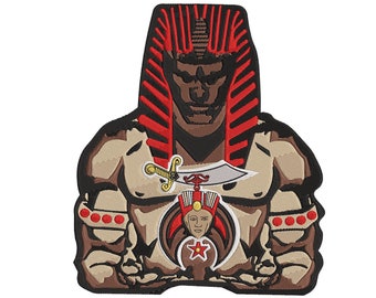 May include: Embroidered patch featuring a muscular pharaoh figure with a red and black headdress. The design includes a sword, a smaller pharaoh image, and a red star. The patch has a tan, brown, and red color scheme.