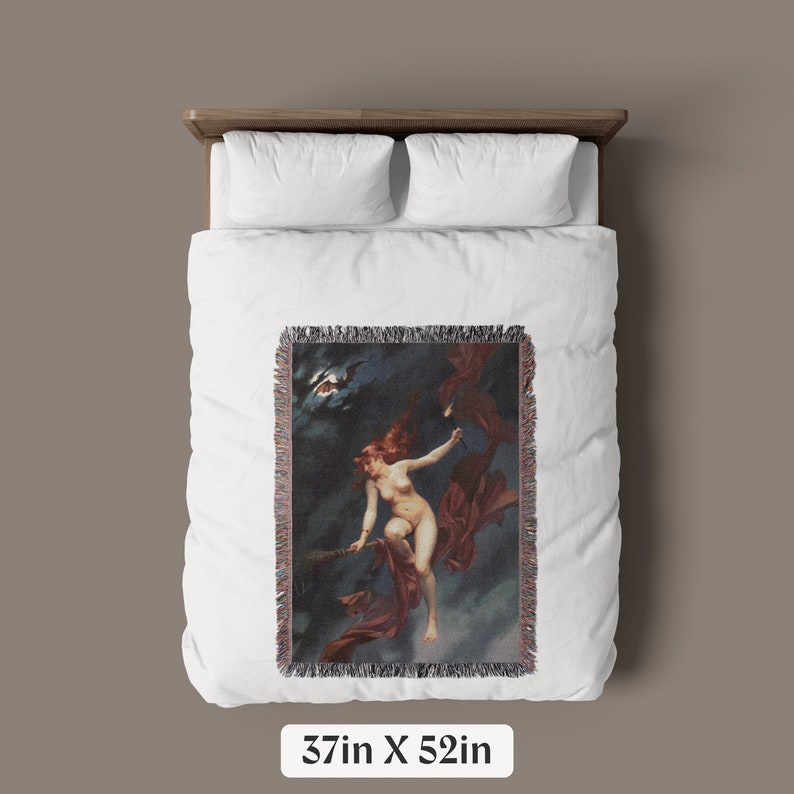 May include: A woven tapestry wall hanging featuring a woman flying on a broomstick with a red cape in a dark sky with a bat flying overhead. The tapestry is 37 inches by 52 inches.