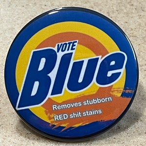 Vote Blue "Removes stubborn red shit stains" Pin-Back Buttons or Magnet 2 1/4 inch.