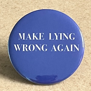 May include: A blue round button with the text "MAKE LYING WRONG AGAIN" in white.
