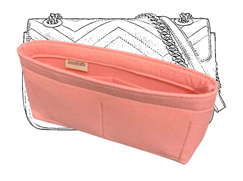 May include: A pink felt bag organiser with multiple compartments and a label that reads "JennyKrafts".