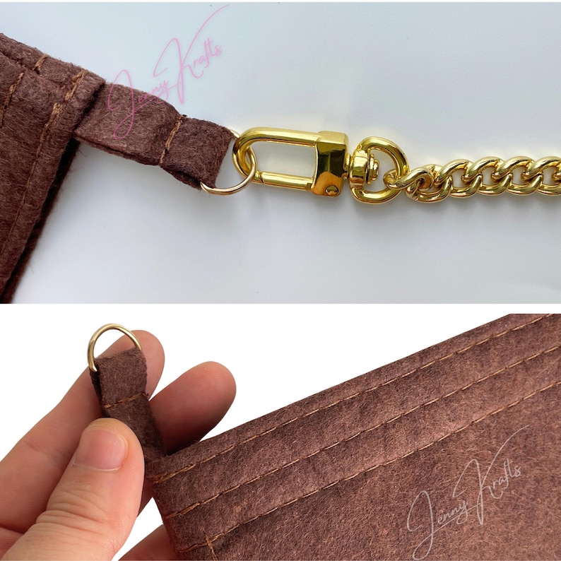 May include: Close-up of a brown felt material with gold-colored chain and clasp. The felt has stitched seams and a small gold ring. The chain is a thick, curb style. The clasp is a swivel type.