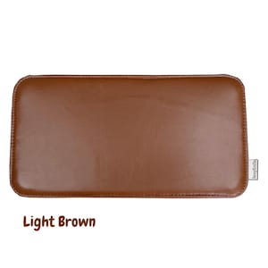 May include: A light brown rectangular leather item with rounded corners. The item has a smooth surface and a stitched border. The text "Light Brown" is at the bottom of the image.