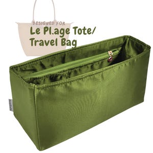 May include: Olive green tote bag organizer with a zippered pocket and a gold-colored zipper pull. The text "DESIGNED FOR Le Plage Tote/ Travel Bag" is visible. The organizer is designed to fit inside a tote bag.