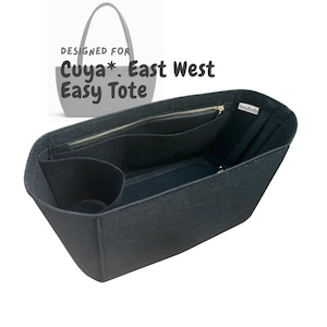 May include: A dark grey tote bag organiser with multiple compartments and a zipped closure. The organiser is designed for the Cuya East West Easy Tote. The text "DESIGNED FOR Cuya*. East West Easy Tote" is visible in the image.