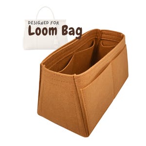 May include: A brown felt bag organizer with multiple compartments and pockets. The text "DESIGNED FOR LOOM BAG" is printed above a white handbag illustration. The organizer is designed to fit inside a handbag.