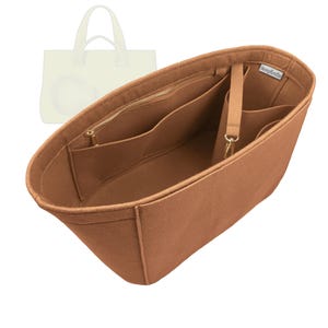 May include: A brown felt bag organiser with multiple compartments and a zipped pocket. The organiser has a small strap with a gold-coloured clasp and is designed to fit inside a tote bag. The brand name "lovemycrafts" is visible.
