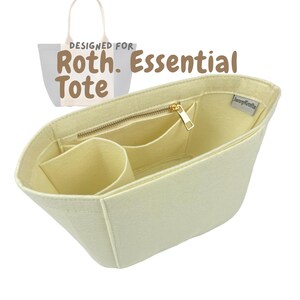 May include: Cream-colored felt tote bag organizer with multiple compartments, including a zippered pocket and several open pockets. The organizer is designed for the Roth Essential Tote. The text "DESIGNED FOR Roth. Essential Tote" is visible.