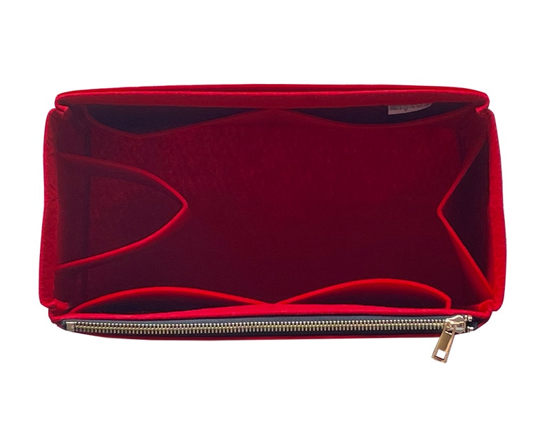 May include: Red felt bag organiser with multiple compartments and a zipper closure.