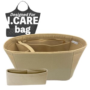May include: Beige felt bag organizer with multiple compartments and a smaller insert. The organizer has a zipper closure and is designed to fit inside a bag. The image also includes a black bag graphic with the text "Designed For I.CARE bag."