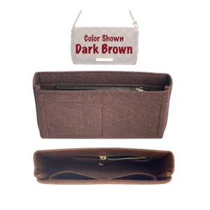May include: A brown felt bag insert with multiple compartments and a zipper closure. The insert is designed to fit inside a handbag to help organise the contents. The text "Color Shown Dark Brown" is visible on the bag.