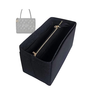 May include: Black felt bag organiser with a zipped compartment and multiple pockets. The organiser is designed to fit inside a larger handbag.