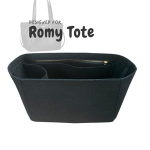 May include: Black felt tote bag organizer with multiple compartments and a zippered pocket. The text "DESIGNED FOR Romy Tote" is displayed above the organizer. The organizer is designed to fit inside a tote bag.
