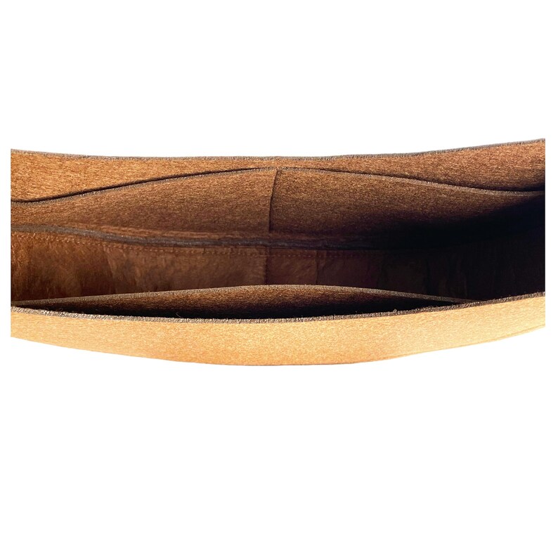 May include: A brown felt bag organizer with multiple compartments. The bag organizer is designed to fit inside a larger bag and help keep items organized.
