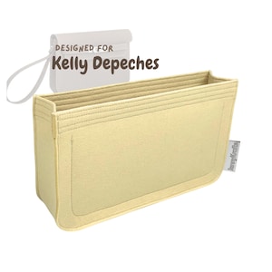 May include: A beige felt bag organiser with multiple compartments. The organiser is designed to fit inside a Kelly Depeches bag. The text "DESIGNED FOR Kelly Depeches" is visible in the image.