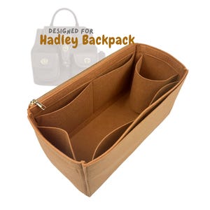 May include: A tan felt bag organizer with multiple compartments and a gold zipper. The organizer is designed for the Hadley Backpack, as indicated by the text in the image.