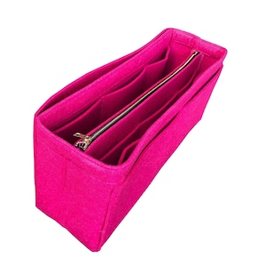 May include: A bright pink felt bag organiser with multiple compartments and a zipped closure.