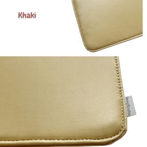 May include: Close-up of a khaki-colored leather product with stitched edges. The text "Khaki" is in the upper left corner. A small tag with the text "JennyKrafts" is visible on the bottom right corner.