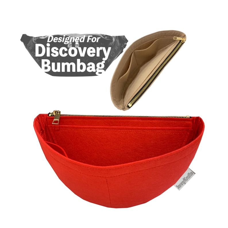 May include: Red felt bag organizer with a gold zipper, designed for a Discovery Bumbag. The organizer has multiple compartments and a beige interior. The text "Designed For Discovery Bumbag" is visible in the image.