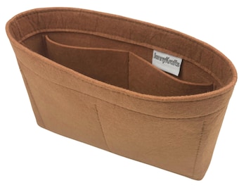 May include: A brown felt handbag organizer with multiple compartments. The organizer has an oval shape and includes a label that reads "JennyKrafts". The organizer is designed to help keep the contents of a handbag organized.