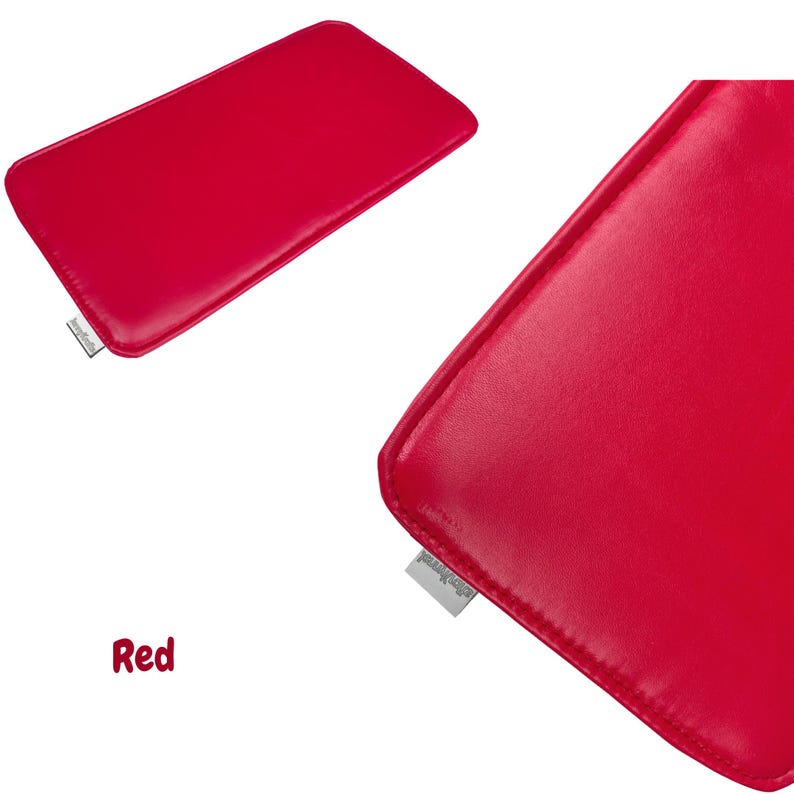 May include: A vibrant red rectangular leather case. The case has rounded corners and a stitched edge. A small, rectangular tag is attached to the bottom left corner of the case. The word "Red" is written in red script in the bottom left corner.