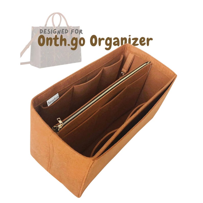 May include: A tan felt bag organiser with multiple compartments and a zipped pocket. The organiser is designed to fit inside a handbag and features the text "DESIGNED FOR Onth.go Organizer".