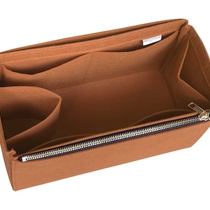 May include: A brown felt bag organizer with multiple pockets and a zippered compartment. The organizer is designed to fit inside a larger bag and help keep it organized.