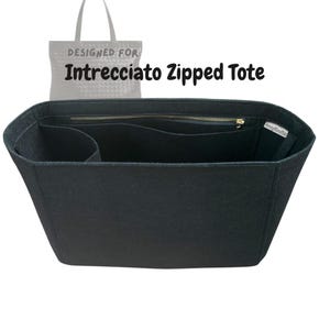 May include: Black felt tote bag organiser with multiple compartments and a zipped top. The text "DESIGNED FOR Intrecciato Zipped Tote" is printed above the bag. The organiser is designed to fit inside a tote bag.