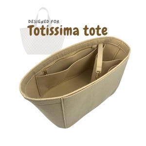 May include: Beige tote bag organiser with multiple pockets and a zipped compartment. The text "DESIGNED FOR Totissima tote" is printed on the image. The organiser is designed to fit inside a tote bag.