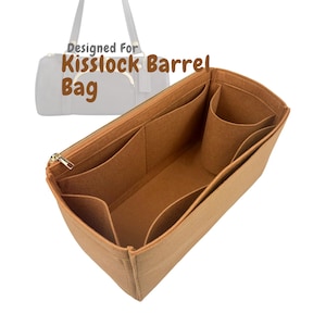 May include: A tan felt bag organizer with multiple compartments and a gold zipper. The text "Designed For Kisslock Barrel Bag" is printed on the image. The organizer is designed to fit inside a handbag.