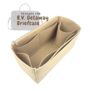 May include: Beige felt bag organizer with multiple compartments and a zippered top. The organizer is designed for a B.V. Getaway Briefcase, as indicated by the text in the image. It features various pockets and a cylindrical holder.